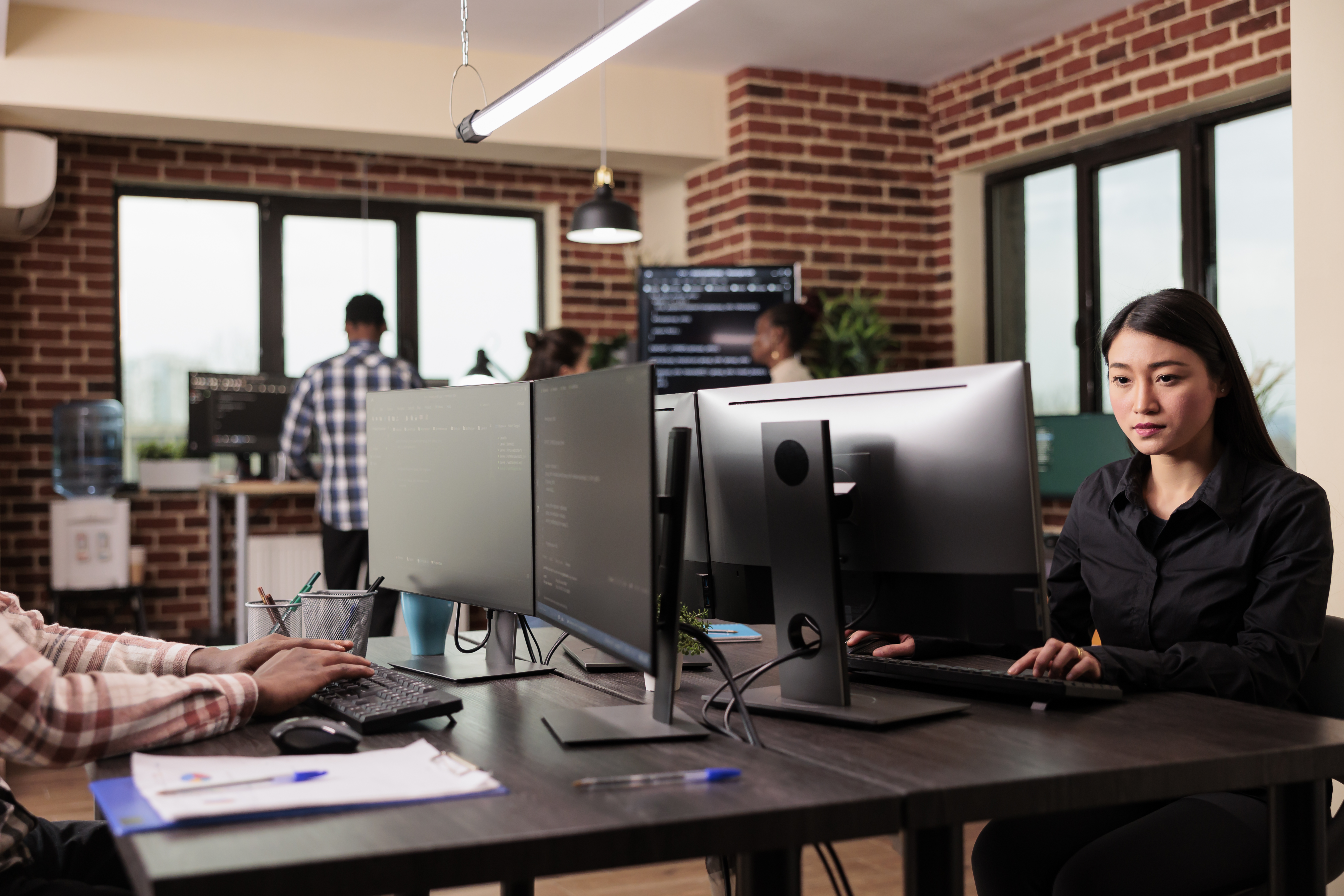 Tech engineers programming server code algorithm on computer, typing sever data in it agency office. Software developer working on new user interface with online system to create algorithm.